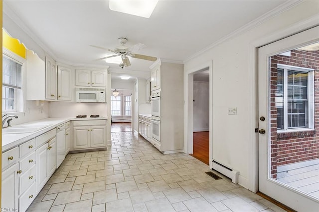 3403 Chesapeake Ave, Hampton, VA 23661 - kitchen featuring white appliances, a sink, a baseboard heating unit, a ceiling fan, and light countertops