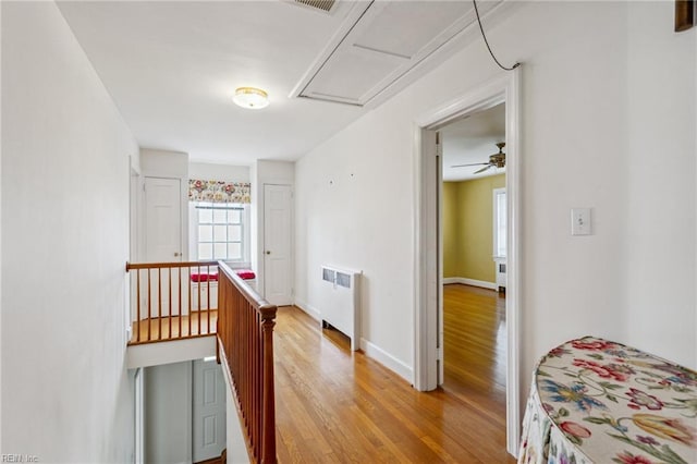 3403 Chesapeake Ave, Hampton, VA 23661 - hall featuring radiator heating unit, an upstairs landing, and light wood finished floors