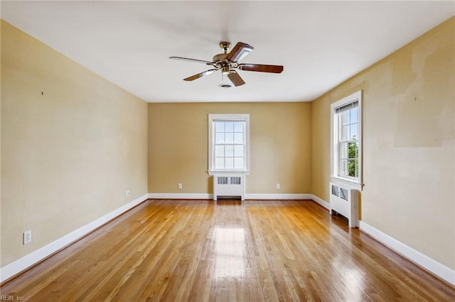 3403 Chesapeake Ave, Hampton, VA 23661 - unfurnished room with radiator heating unit, plenty of natural light, and light wood-style floors