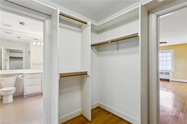 3403 Chesapeake Ave, Hampton, VA 23661 - walk in closet featuring radiator heating unit and wood finished floors