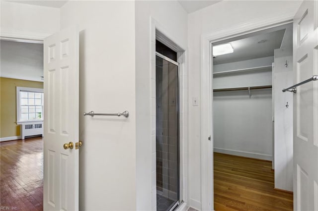 3403 Chesapeake Ave, Hampton, VA 23661 - bathroom with radiator heating unit, wood finished floors, and a shower stall