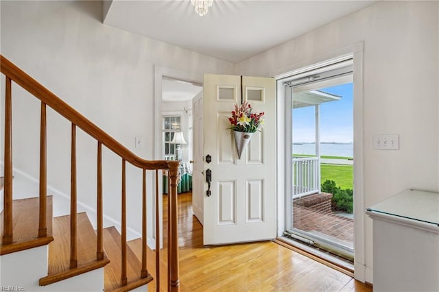3403 Chesapeake Ave, Hampton, VA 23661 - entrance foyer with a water view, light wood-type flooring, healthy amount of natural light, and stairs
