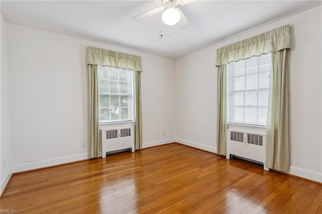 3403 Chesapeake Ave, Hampton, VA 23661 - empty room with radiator, plenty of natural light, and wood-type flooring