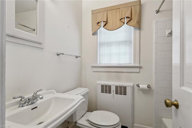 3403 Chesapeake Ave, Hampton, VA 23661 - full bathroom with radiator, a sink, toilet, and washtub / shower combination