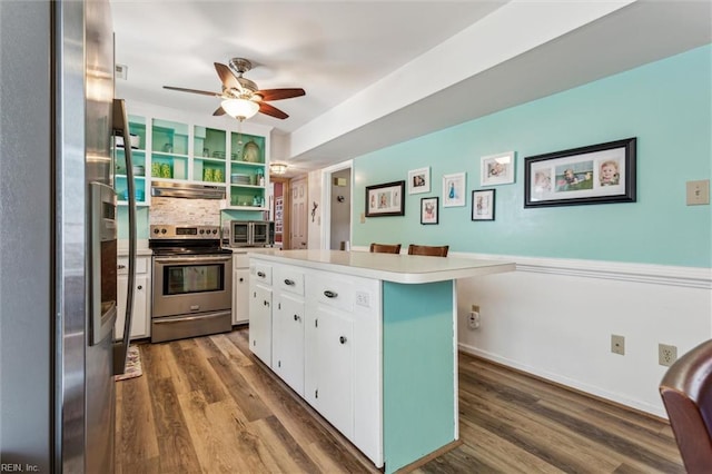 107 Benson Dr, Hampton, VA 23664 - kitchen with appliances with stainless steel finishes, white cabinetry, open shelves, dark wood finished floors, and under cabinet range hood