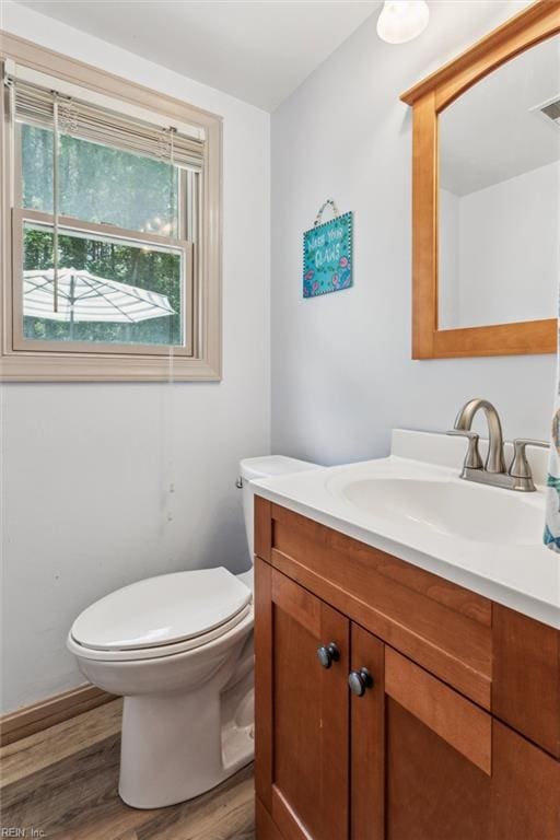 107 Benson Dr, Hampton, VA 23664 - half bathroom with vanity, wood finished floors, and toilet