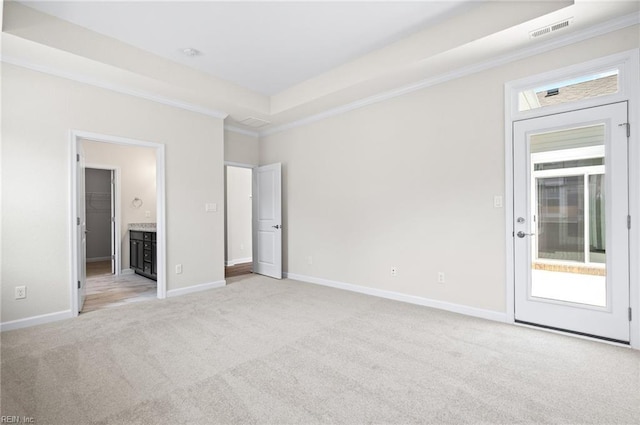 2300 Venture Way Unit B, Suffolk, VA 23434 - unfurnished bedroom featuring light carpet, crown molding, baseboards, a raised ceiling, and ensuite bathroom