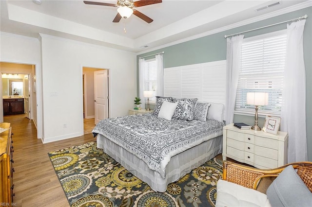 2300 Venture Way Unit B, Suffolk, VA 23434 - bedroom featuring a raised ceiling, wood finished floors, baseboards, crown molding, and ceiling fan