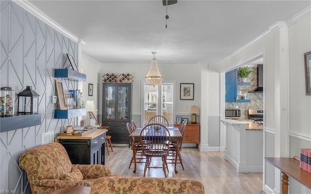 4201 Newport Ave, Norfolk, VA 23508 - dining room featuring light wood-style floors, a chandelier, and ornamental molding