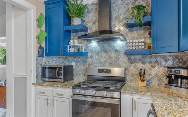 4201 Newport Ave, Norfolk, VA 23508 - kitchen with open shelves, stainless steel appliances, wall chimney range hood, and blue cabinets