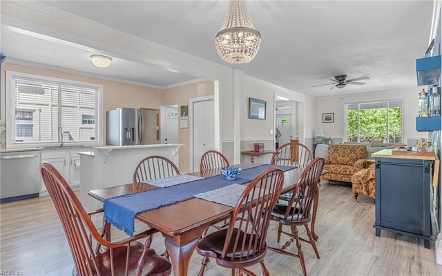 4201 Newport Ave, Norfolk, VA 23508 - dining room featuring light wood finished floors, a ceiling fan, a chandelier, and crown molding