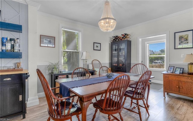 4201 Newport Ave, Norfolk, VA 23508 - dining area featuring healthy amount of natural light, a chandelier, crown molding, light wood-style flooring, and baseboards