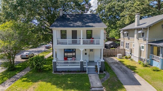 4201 Newport Ave, Norfolk, VA 23508 - view of front of home with a porch, a balcony, and asphalt driveway