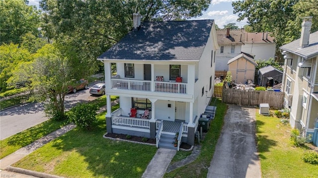 4201 Newport Ave, Norfolk, VA 23508 - view of front of home with a porch, driveway, a balcony, and a shingled roof