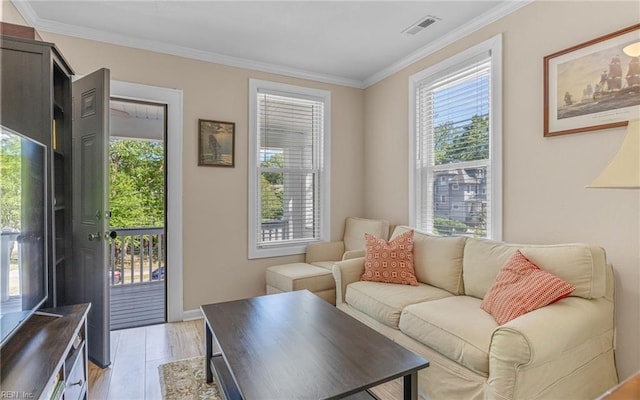 4201 Newport Ave, Norfolk, VA 23508 - living room featuring healthy amount of natural light, crown molding, light wood-style flooring, and baseboards
