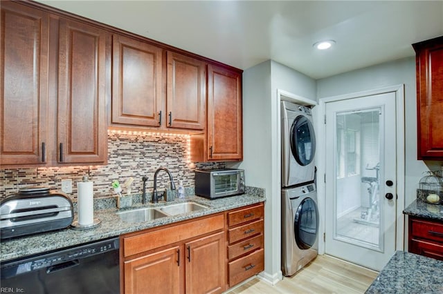 3521 Wayne St, Virginia Beach, VA 23452 - washroom with stacked washing machine and dryer and light wood-style flooring