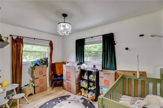 3521 Wayne St, Virginia Beach, VA 23452 - bedroom with multiple windows, light wood finished floors, and a chandelier