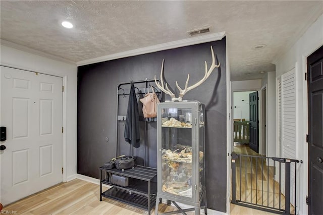 3521 Wayne St, Virginia Beach, VA 23452 - entrance foyer with wood finished floors, ornamental molding, a textured ceiling, and recessed lighting
