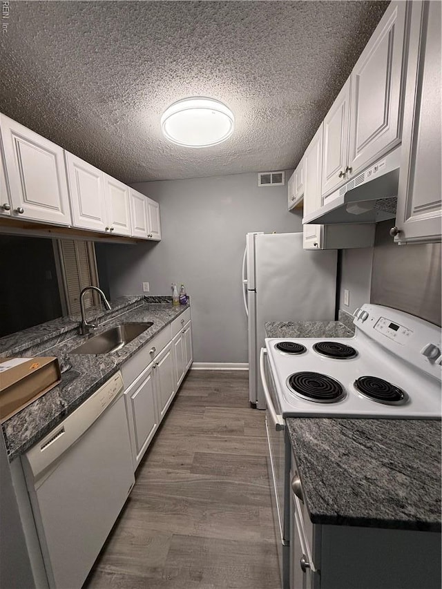 5608 Summit Arch, Virginia Beach, VA 23462 - kitchen with a sink, white appliances, under cabinet range hood, a textured ceiling, and white cabinetry