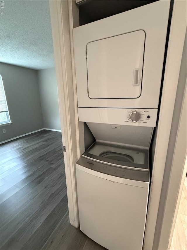 5608 Summit Arch, Virginia Beach, VA 23462 - laundry area featuring stacked washing machine and dryer, dark wood-style floors, baseboards, and a textured ceiling