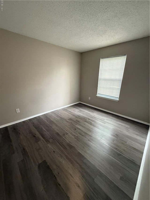 5608 Summit Arch, Virginia Beach, VA 23462 - spare room with dark wood finished floors, a textured ceiling, and baseboards