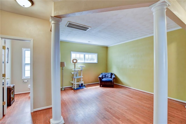 1757 Brigands Way, Virginia Beach, VA 23453 - sitting room featuring ornate columns, wood finished floors, crown molding, and baseboards