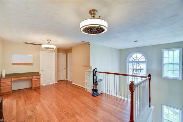 1757 Brigands Way, Virginia Beach, VA 23453 - empty room featuring light wood-type flooring, plenty of natural light, an office area, and baseboards