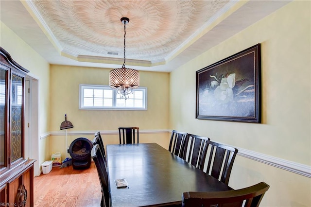 1757 Brigands Way, Virginia Beach, VA 23453 - dining room with a raised ceiling, a chandelier, wood finished floors, and ornamental molding