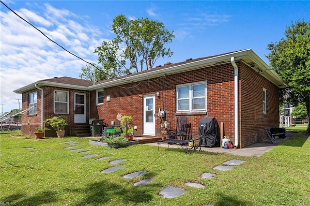1232 Typo Ave, Norfolk, VA 23502 - back of property with brick siding, entry steps, and a lawn