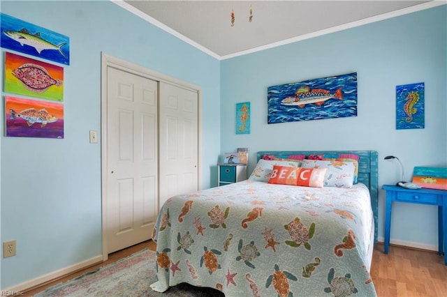 1026 High Dunes Quay Quay Unit 201, Hampton, VA 23664 - bedroom with ornamental molding, wood finished floors, a closet, and baseboards