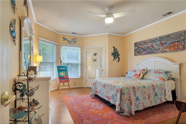 1026 High Dunes Quay Quay Unit 201, Hampton, VA 23664 - bedroom featuring wood finished floors, a textured ceiling, ornamental molding, baseboards, and ceiling fan