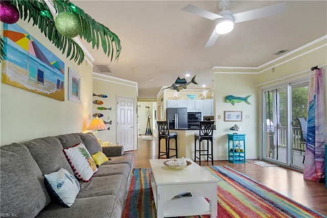 1026 High Dunes Quay Quay Unit 201, Hampton, VA 23664 - living room with wood finished floors, ornamental molding, and a ceiling fan