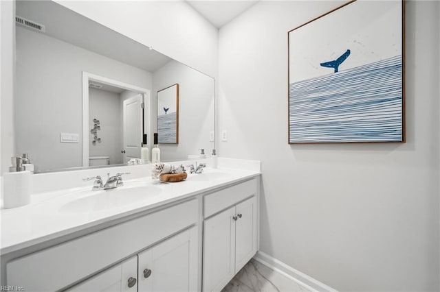 3031 Dalton Cir, Suffolk, VA 23435 - bathroom with marble finish floors, double vanity, baseboards, and toilet
