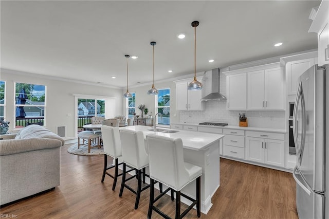 3001 Brylie Ct, Suffolk, VA 23435 - kitchen with freestanding refrigerator, wall chimney exhaust hood, a sink, stovetop, and open floor plan