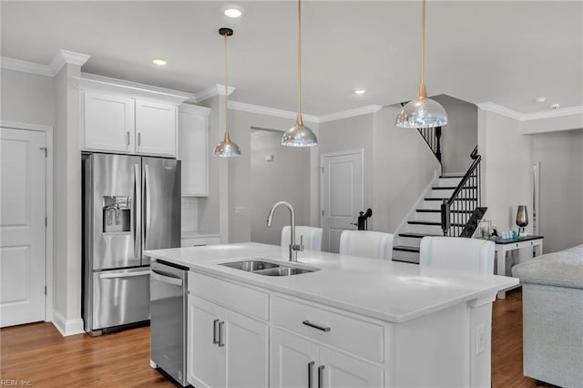 3001 Brylie Ct, Suffolk, VA 23435 - kitchen with appliances with stainless steel finishes, a sink, ornamental molding, dark wood finished floors, and white cabinets