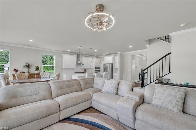 3001 Brylie Ct, Suffolk, VA 23435 - living area with ornamental molding, healthy amount of natural light, stairs, recessed lighting, and a chandelier