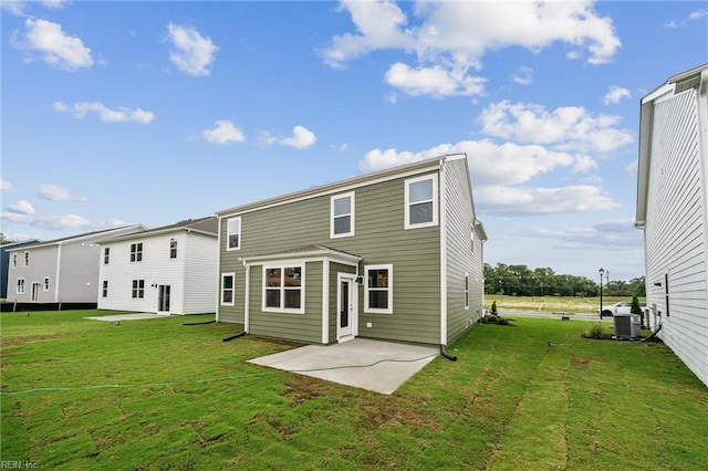 3023 Dalton Cir, Suffolk, VA 23435 - rear view of house with a patio area, a lawn, and central AC