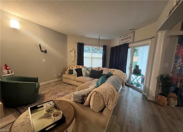 1031 High Dunes Quay Quay Unit 103, Hampton, VA 23664 - living area featuring wood finished floors and a textured ceiling