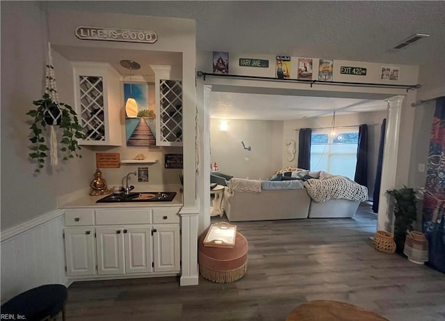 1031 High Dunes Quay Quay Unit 103, Hampton, VA 23664 - interior space with wood finished floors, a wainscoted wall, and wet bar
