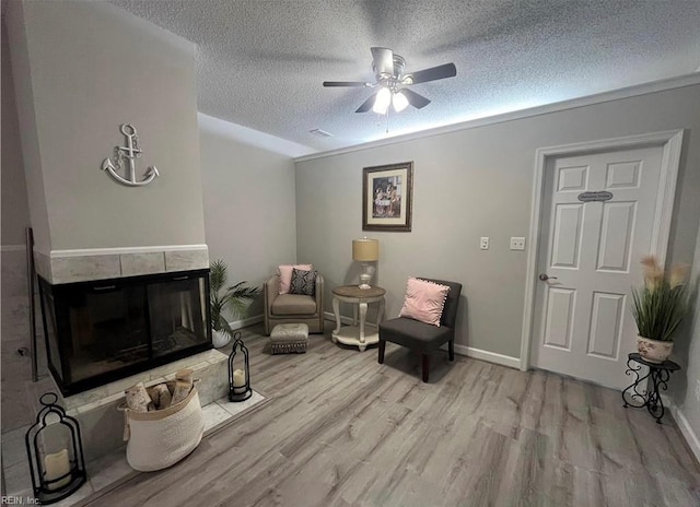 1031 High Dunes Quay Quay Unit 103, Hampton, VA 23664 - living area with light wood-type flooring, a ceiling fan, a textured ceiling, and baseboards