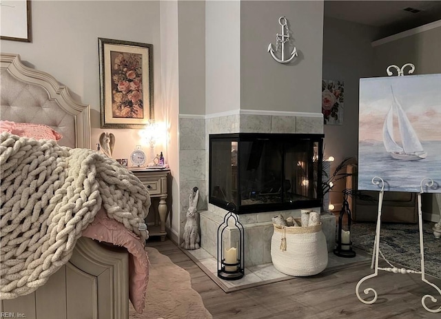 1031 High Dunes Quay Quay Unit 103, Hampton, VA 23664 - living room featuring wood finished floors and a tile fireplace