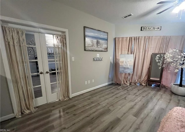1031 High Dunes Quay Quay Unit 103, Hampton, VA 23664 - interior space featuring wood finished floors, ceiling fan, french doors, baseboards, and a textured ceiling