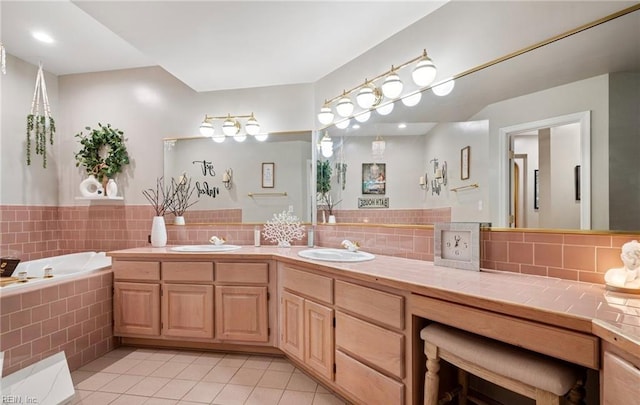 1031 High Dunes Quay Quay Unit 103, Hampton, VA 23664 - bathroom with tile patterned floors, double vanity, a bath, and backsplash
