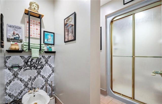 1031 High Dunes Quay Quay Unit 103, Hampton, VA 23664 - full bathroom featuring a shower stall, a bidet, tile patterned flooring, and baseboards