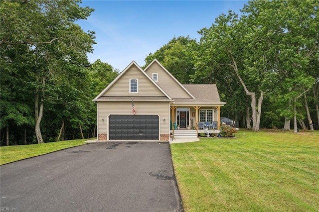 183 Belle Aire Dr, Hardyville, VA 23070 - traditional home featuring a porch, an attached garage, driveway, and a front yard