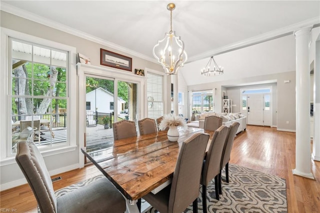 183 Belle Aire Dr, Hardyville, VA 23070 - dining space featuring a chandelier, light wood-style flooring, baseboards, ornamental molding, and decorative columns