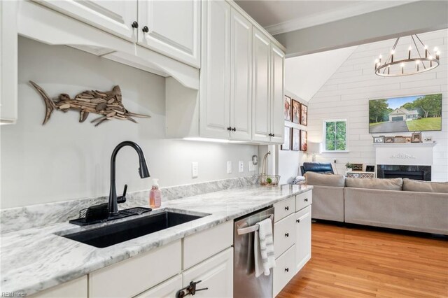 183 Belle Aire Dr, Hardyville, VA 23070 - kitchen featuring dishwasher, a sink, lofted ceiling, a chandelier, and white cabinetry