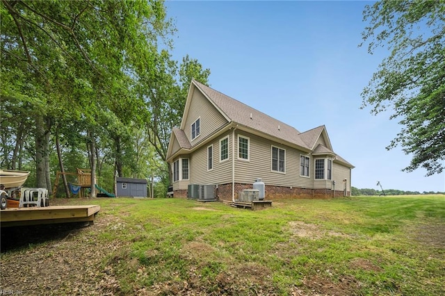 183 Belle Aire Dr, Hardyville, VA 23070 - back of property featuring central air condition unit, a yard, and a playground