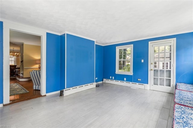 28 Shirley Rd, Newport News, VA 23601 - unfurnished room featuring a chandelier, a baseboard radiator, wood finished floors, and ornamental molding