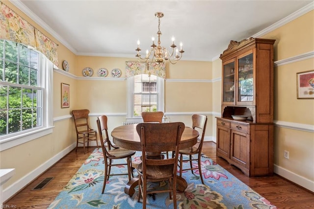 28 Shirley Rd, Newport News, VA 23601 - dining area with a chandelier, wood finished floors, baseboards, and crown molding
